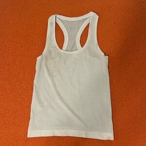 White Lululemon racerback swiftly tech tank top size 0